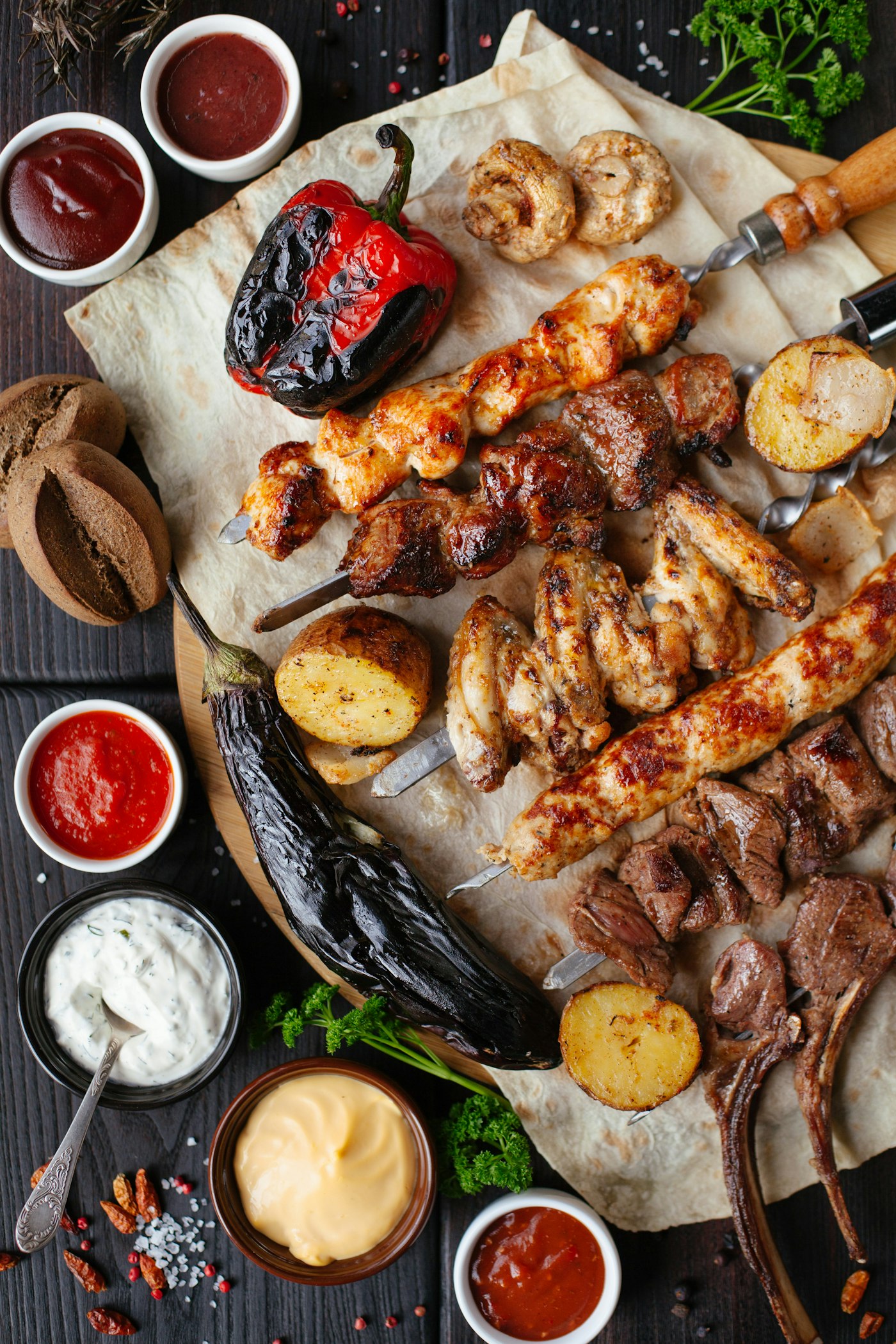 Middle Eastern mixed grill with kebabs, flatbread, and dips